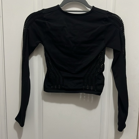 Top from Urban Outfitters with holes on the sleeves and along the middle - Picture 2 of 2